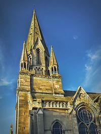 Low angle view of church against blue sky