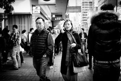 People walking on street in city