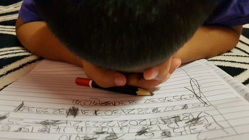 Close-up of boy holding book