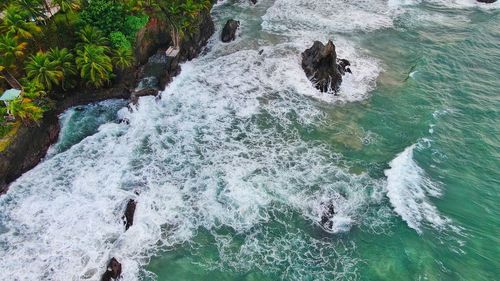 High angle view of water flowing through rocks