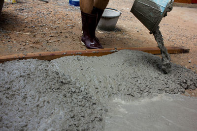 Low section of man working at construction site