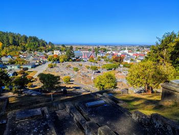 High angle view of townscape against clear blue sky