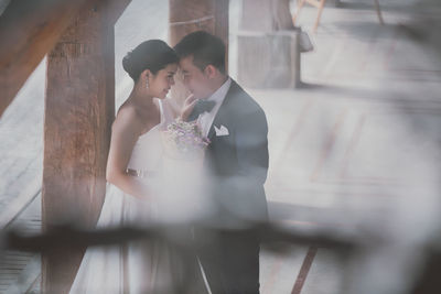 Midsection of couple holding hands