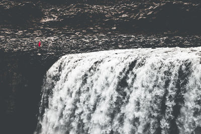 Water splashing in sea against sky