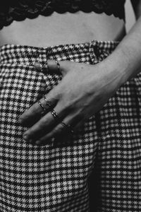 High angle view of woman hand on patterned wall