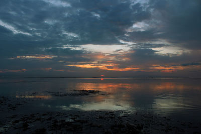 Scenic view of sea against sky during sunset. sanur beach, bali, indonesia. 