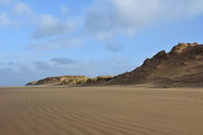 Scenic view of desert against sky