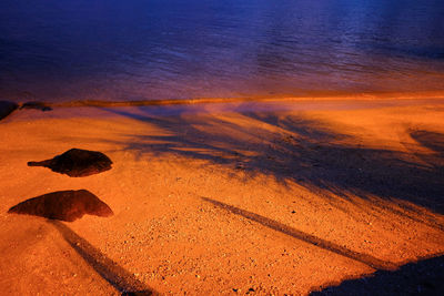 Scenic view of sand against sky during sunset