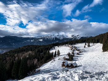 Scenic view of snowcapped mountains against sky