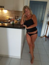 Smiling young woman at home