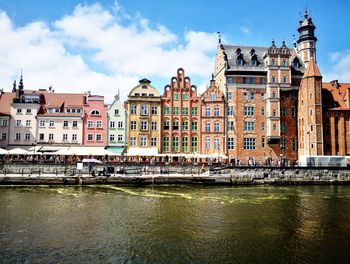 View of buildings against cloudy sky