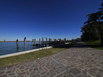 Scenic view of sea against clear blue sky