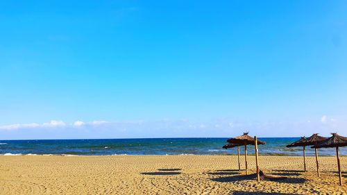 Scenic view of sea against blue sky