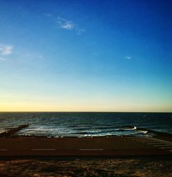 Scenic view of sea against blue sky