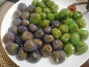 High angle view of fruits in plate on table