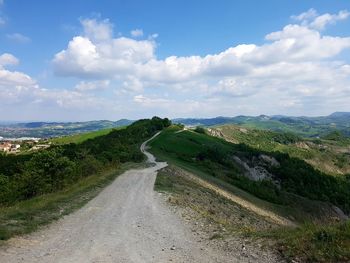 View of road against cloudy sky