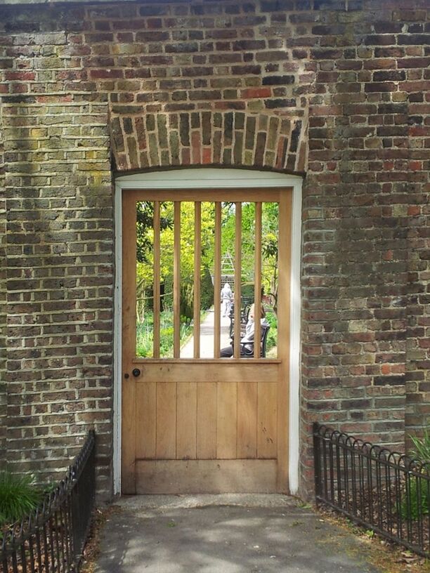 architecture, built structure, building exterior, window, brick wall, closed, wall - building feature, house, wall, door, old, day, no people, gate, outdoors, safety, metal, entrance, metal grate, protection