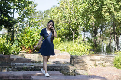 Full length of woman standing at park