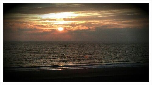 Scenic view of sea at sunset