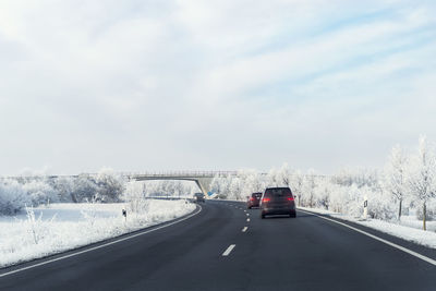 Road by snow covered landscape