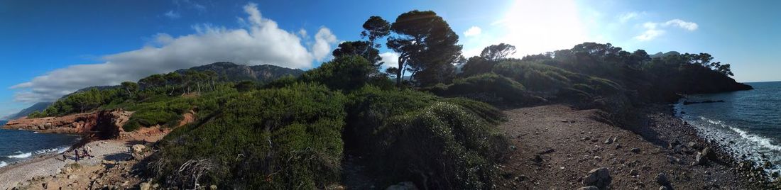 Low angle view of rock formation by sea against sky