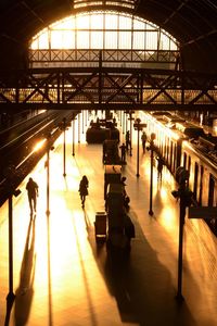 High angle view of people walking on railroad station platform