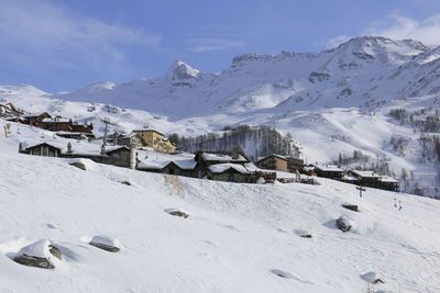 Scenic view of snow covered mountains against sky