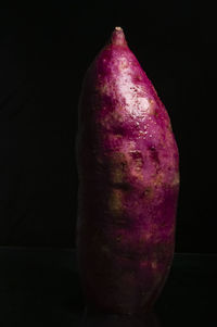 Close-up of apple against black background