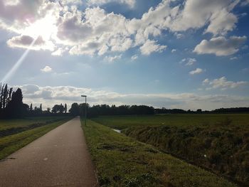 Surface level of empty road along countryside landscape