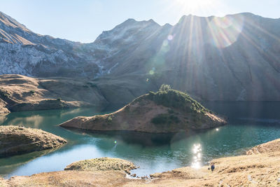 Panoramic view of lake and mountains against sky