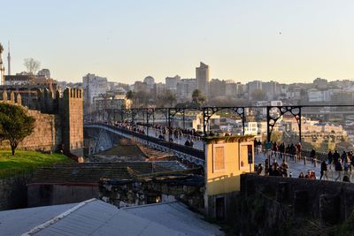 High angle view of bridge over river against buildings in city