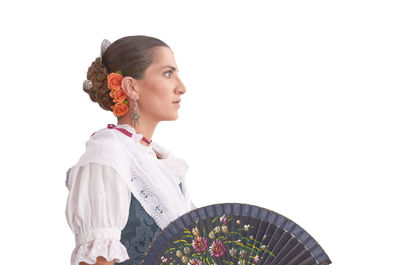 Full length of young woman against white background