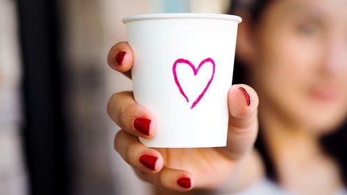 Close-up of hand holding heart shape