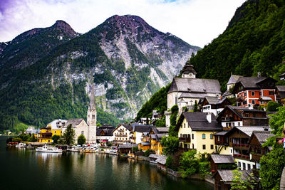 Town by river and buildings in mountains