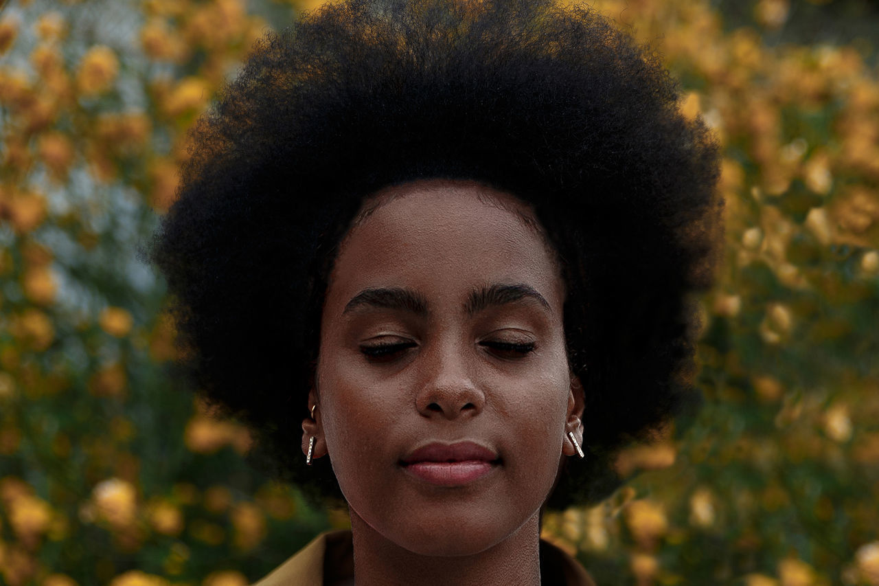 PORTRAIT OF WOMAN WITH EYES CLOSED