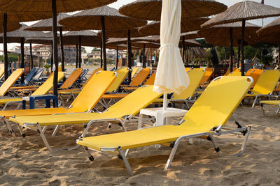 Yellow empty beach beds. beach before sunrise.