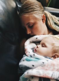 Mother with baby sleeping