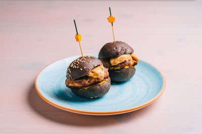 Close-up of burger in plate on table