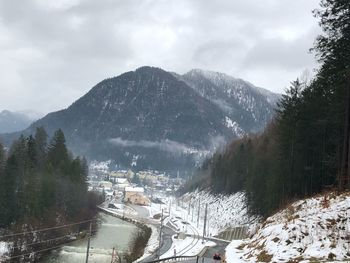 Scenic view of snowcapped mountains against sky