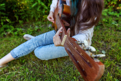 Young woman playing guitar