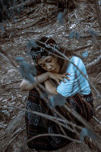 High angle view of girl in traditional blanket