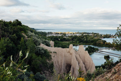 Scenic view of sea against cloudy sky