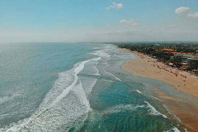 Scenic view of sea and landscape against sky