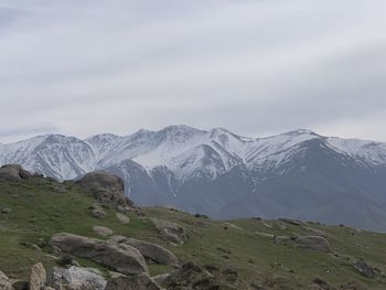 Scenic view of snowcapped mountains against sky