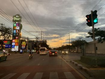 Cars on road at dusk