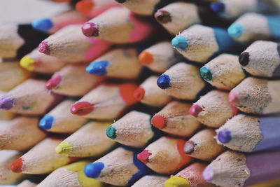 Full frame shot of multi colored pencils on table