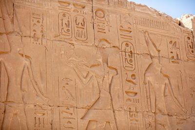 Different hieroglyphs on the walls and columns in the karnak temple.