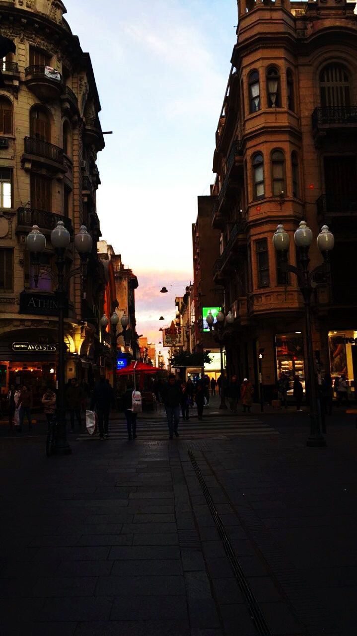 PEOPLE WALKING ON STREET IN CITY