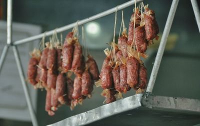 Close-up of meat hanging on rack