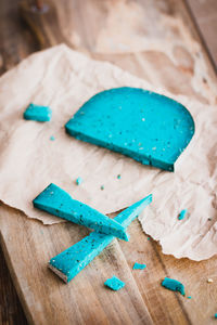 Close-up of blue paint on table